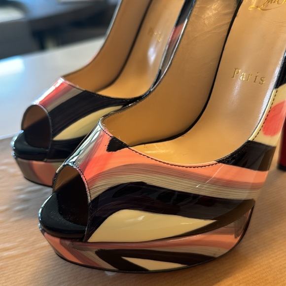 Christian Louboutin heels. I am a true US 7.5 size and they fit perfectly. - Picture 11 of 16